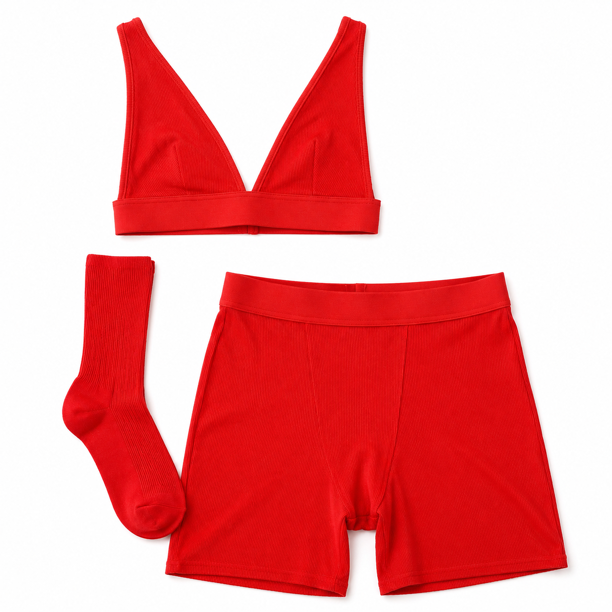 Red sports bra, shorts, and socks on a white background